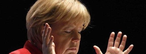Merkel than phiền về dân di cư
